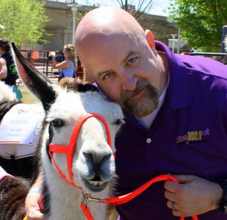 Marc Anthony of Star 102.1 with his West High School llama. (Photo Heidi Hornick)