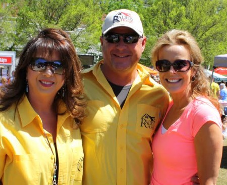 Sharlyn Chrisman (left) and her husband Blane Chrisman of Radius Homes, presenting sponsor of the event, with race founder Lori Santoro. (Photo by Heidi Hornick)
